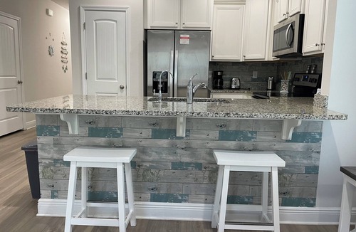 Thomas Drive House | Beach themed 3 bedroom 2 bath townhome with pool view