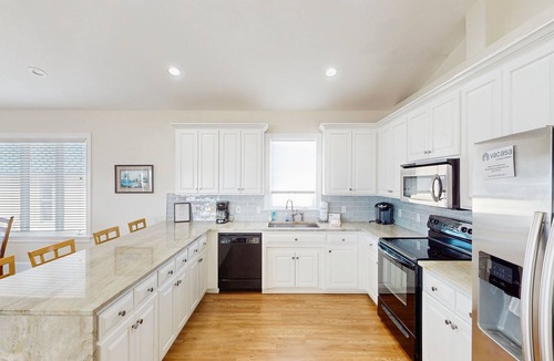 Plantation House | Beachfront home with a pool, game room, deck, grill, washer/dryer & central AC