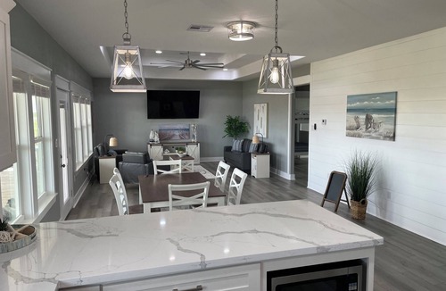 Port Bolivar Cabin | Beautiful Canal front Cabin, Golf Cart Ride to Beach, 2 miles New Rollover Pier