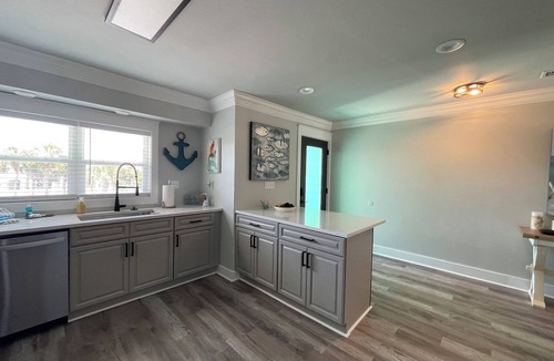 Holiday Isle House | Boaters paradise 4 bedroom 3 bath with 50' ft BOAT SLIP! Beach access