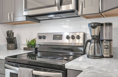 Tulane - Gravier Apartment | Bright 3BR Mid-City home with private patio & fenced yard. Steps to streetcar, near FQ & Superdome