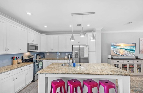 Butler Beach House | Canal Home, Dock, BBQ, Walk to Beach, Fishing