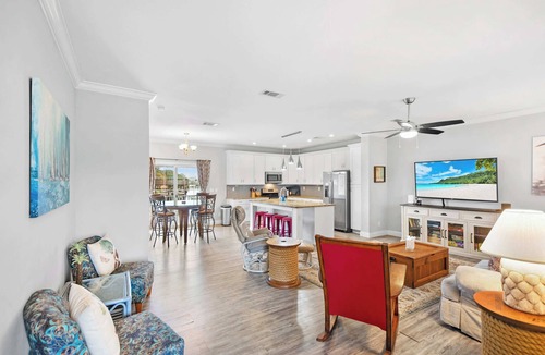 Butler Beach House | Canal Home, Dock, BBQ, Walk to Beach, Fishing