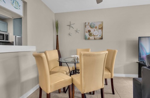 Holiday Isle Condo | Canal Unit with 2 BR/2 Baths & Free Beach Setup!