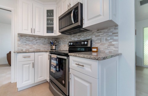 Laurel House | Close to beach with huge heated pool in bird sanctuary. Paradise!