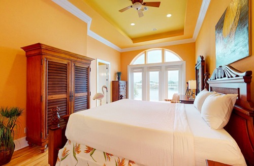 Sunset Pass House | Colorful end unit townhome with resort amenities, sound views, W/D, & AC