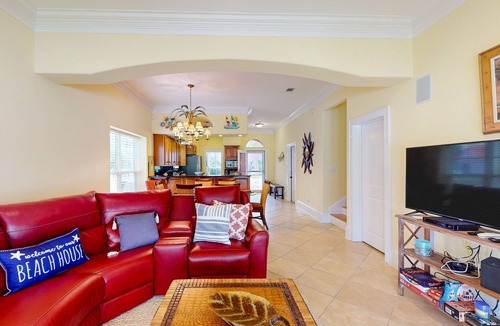 Sunset Pass House | Colorful end unit townhome with resort amenities, sound views, W/D, & AC