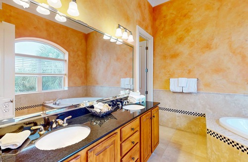 Sunset Pass House | Colorful end unit townhome with resort amenities, sound views, W/D, & AC