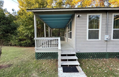 Zwolle Cabin | Couples Retreat with King Canopy Bed, Jacuzzi for Two, Fireplace & Pond-View Porch