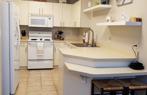 Vanderbilt Beach House | Cozy and spacious 3/2 condo. Family friendly. 3 Mins to the beach. Dog friendly