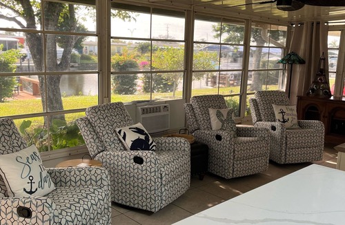 Edgewater House | Cozy South West Florida Escape on canal w/working space & pet friendly.