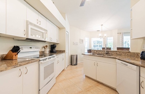 Crown Pointe House | Crown Pointe lake view heated pool home (w/2 King bedrooms) minutes to downtown & beaches!