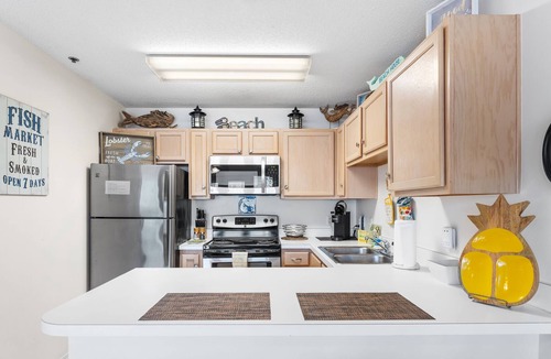 Crystal Beach Condo | CRYSTAL BEACH Grand Caribbean West #202 Ocean Views & a few steps to The Beach!