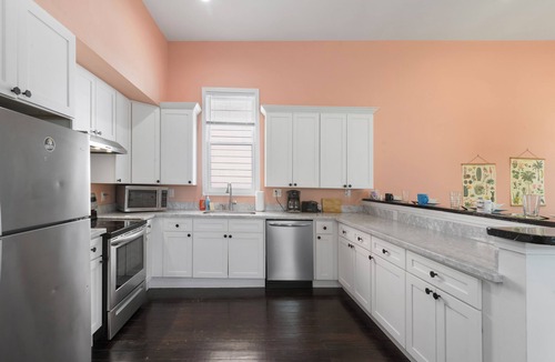 Saint Roch House | Cute and Cozy 2BR/2BA w/Parking, Yard, King Suite & Blocks to Local Favorites