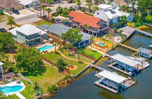 Holiday Beach House | Dancin on the Waves On Lagoon Boat dock, Pool, Firepit