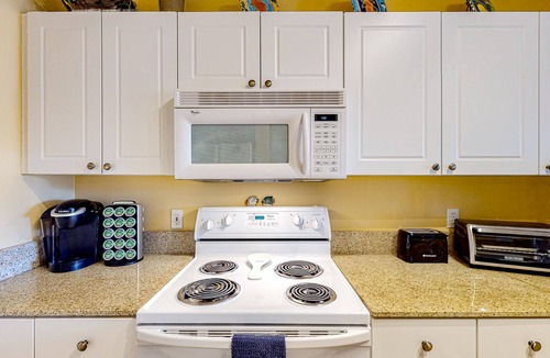 Frangista Beach Condo | Dog-friendly condo with pool, hot tub, private balcony, AC, & washer/dryer