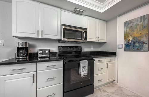 East Naples House | Dog-friendly lakefront home with hot tub, gazebo, firepit, outdoor kitchen, W/D