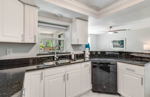 East Naples House | Dog-friendly lakefront home with hot tub, gazebo, firepit, outdoor kitchen, W/D