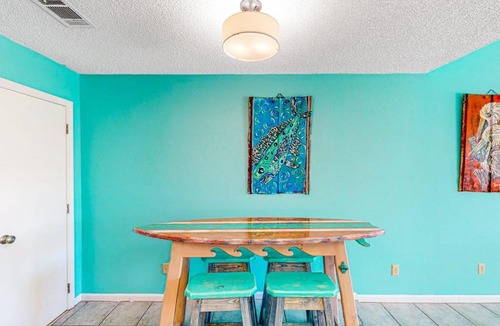 East End House | Dog-friendly poolside townhouse with community pool grills deck beach gear AC