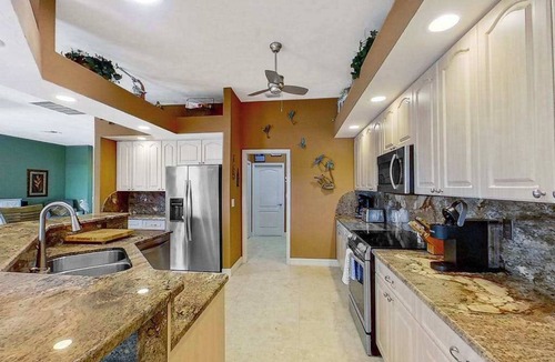 Matlacha Isles House | Dog-friendly waterfront home with heated pool, lanai, central AC, & W/D