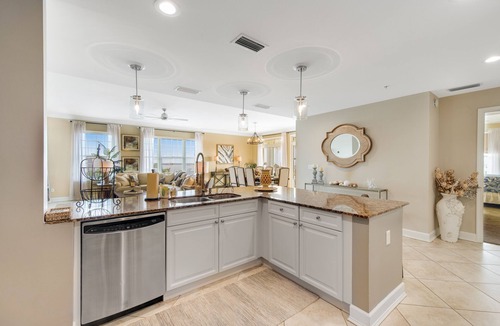 Upper Grand Lagoon Condo | Elegant Fourth Floor Condo with Shared Pool & Hot Tub, Ocean View, and WiFi