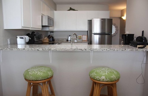 St. George Island Condo | EMBRACE NATURAL BEAUTY with elegant refinement. Exquisite decor emulates a tropical paradise.
