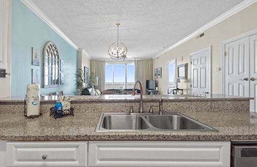 West Panama City Beach Condo | Emerald Isle 1401 - Front row beach chair service included! Affordable rates!
