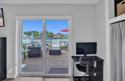 East Fort Lauderdale Condo | Enjoy scenic sunsets on your private deck. Modern condo minutes to the beach.