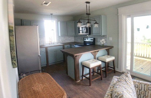 Port St. Joe Cottage | Enjoy sunrise and sunsets on the huge deck and covered bar!