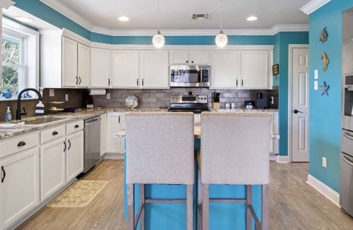 New Orleans East Area House | Enjoy this serene waterfront getaway with boat dock and deck.