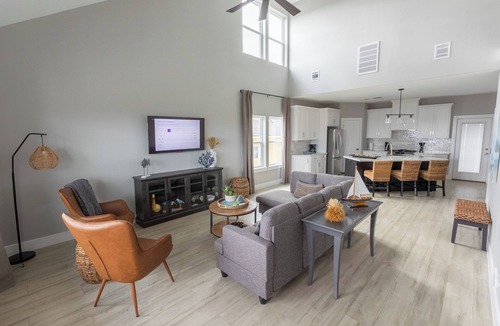 El Lago House | Escape to Seabrook Shores, a cozy 3BR/2BA bayfront retreat with stunning sunset views, a spacious deck, full kitchen, and relaxing living space. Enjoy kayaking, fishing, and nearby Kemah Boardwalk.