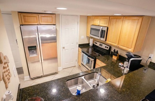 Biloxi Condo | Experience the best of Biloxi. ✨ Luxury 2BR retreat steps from the beach & Casino District. Sophisticated, central, and exclusive. Book now!