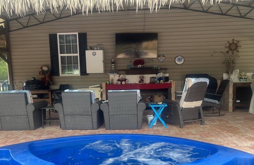 Magnolia Bluffs House | Family secure home with your own Tiki Hut close to Beach SGI. Clean and modern.