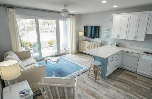 Gulf Place Condo | First floor condo overlooking the heated pool. Steps from the private beach!