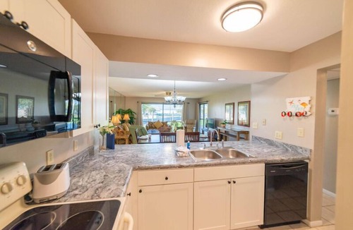 Panama City Beach Condo | Flamingo Sunset Edgewater Villa 907-2nd Floor End Unit-Golf & Pond Views-Free Beach Tram!