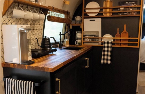Honey Grove Apartment | Glamping in a remodeled Airstream in the Woods