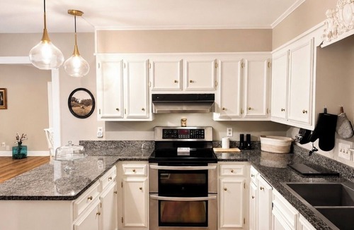 Daphne House | Grand Oak Cottage in Olde Town, 2 King Primary Suites, year round Saltwater Pool