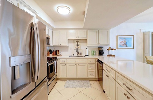 Upper Grand Lagoon Condo | Ground Floor Condo with Shared Pool, Golf Access, Bay Views, and WiFi