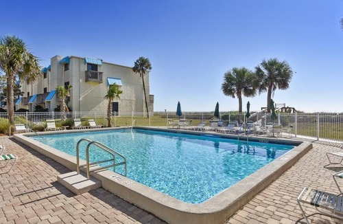 St. George Island Condo | HEAR THE ROAR of the ocean and the slow flapping of the blue herons.