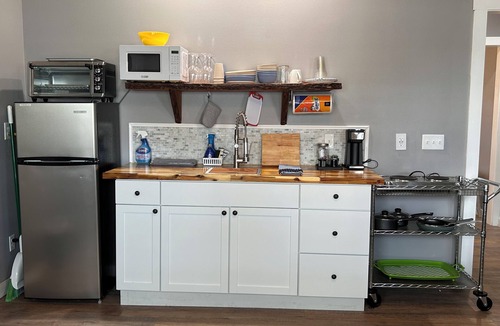 Southport Cottage | Lake Front Rental in Panama City with Kayak, EV Charger, & Dock - Dog Friendly