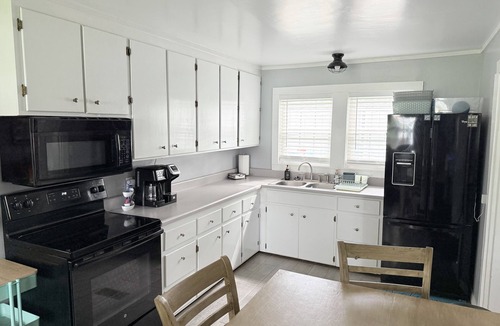 Thomas Drive House | Lakefront Home + Private Beach + Firepit + Kayaks + Pets