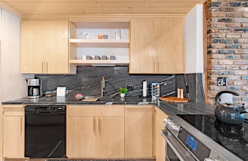 Tool House | Lakefront home with luxury touches. Ample outdoor space for making memories.