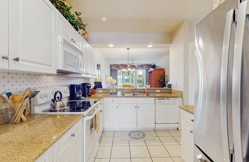 Naples Condo | Lakefront home with water view, golf, pool, hot tub, & tennis