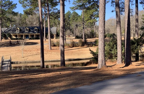 Hattiesburg House | Lakeside pavilion on private lake with a boathouse, outdoor fireplace, kayaks.