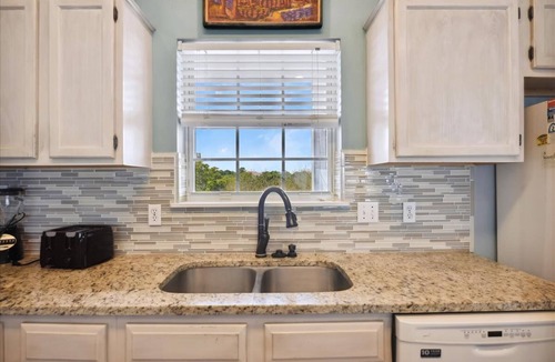 Sea Palm Village House | LEAVE YOUR WORRIES SURFSIDE. Take the private boardwalk and you're only steps from the beach.
