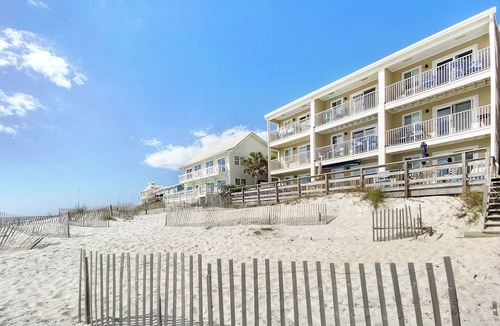SeaNest Village Condo | "Leeward II-3" | Beachfront Condo | Large first level deck with steps down to sand