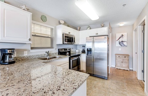 Navarre Beach Condo | Lovely condo with shared pool, washer/dryer, high-speed WiFi, and central AC