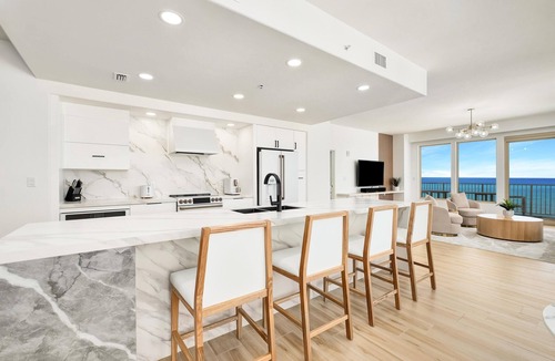 Thomas Drive Condo | Luxurious renovated Gulf-front condo with complimentary Beach Chair Service!