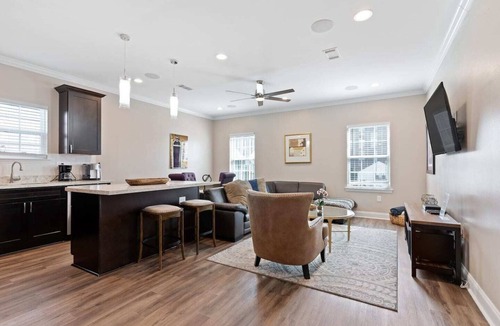 Tulane - Gravier Apartment | Modern 4BR Mid-City home with heated pool & balcony. Free parking, walk to streetcar & parades.