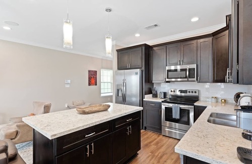 Tulane - Gravier Apartment | Modern 4BR Mid-City home with heated pool & balcony. Free parking, walk to streetcar & parades.